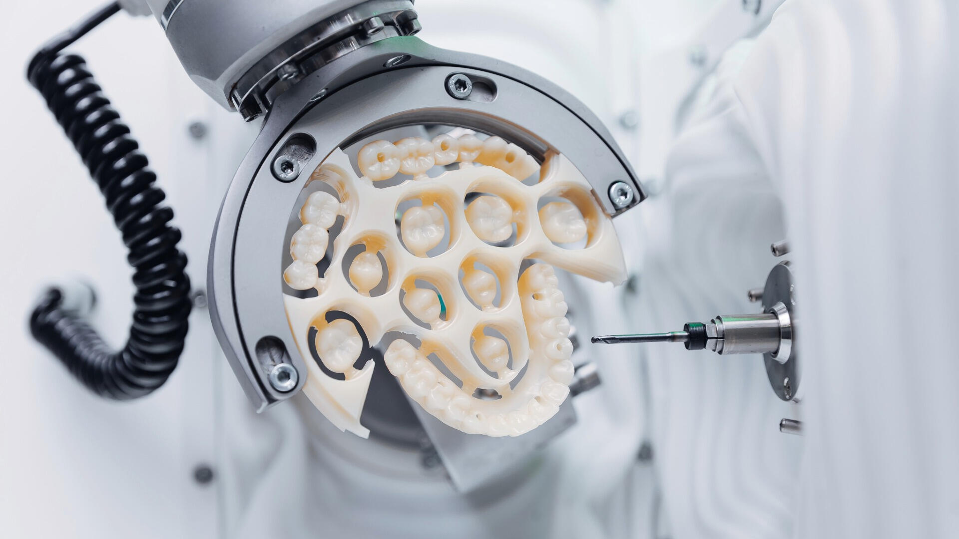 Clean modern dental lab interior at Rutherford Dental Lab in Livermore CA showing precision milling equipment and CAD CAM workflow for R.I.S.E. crown program